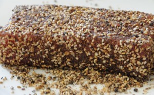 Coating the Tuna with peppers and seeds